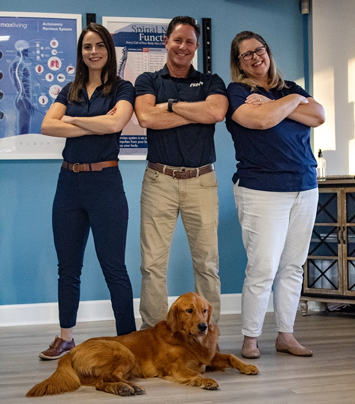 Chiropractor Tallahassee FL Ryan Fenn And Shannon Lord With Staff And Dog